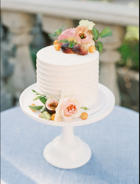 Blueberry Moon Cakes: a photo of a small fresh flower white wedding cake. www.blueberrymooncakes.co.uk. Bristol, UK
