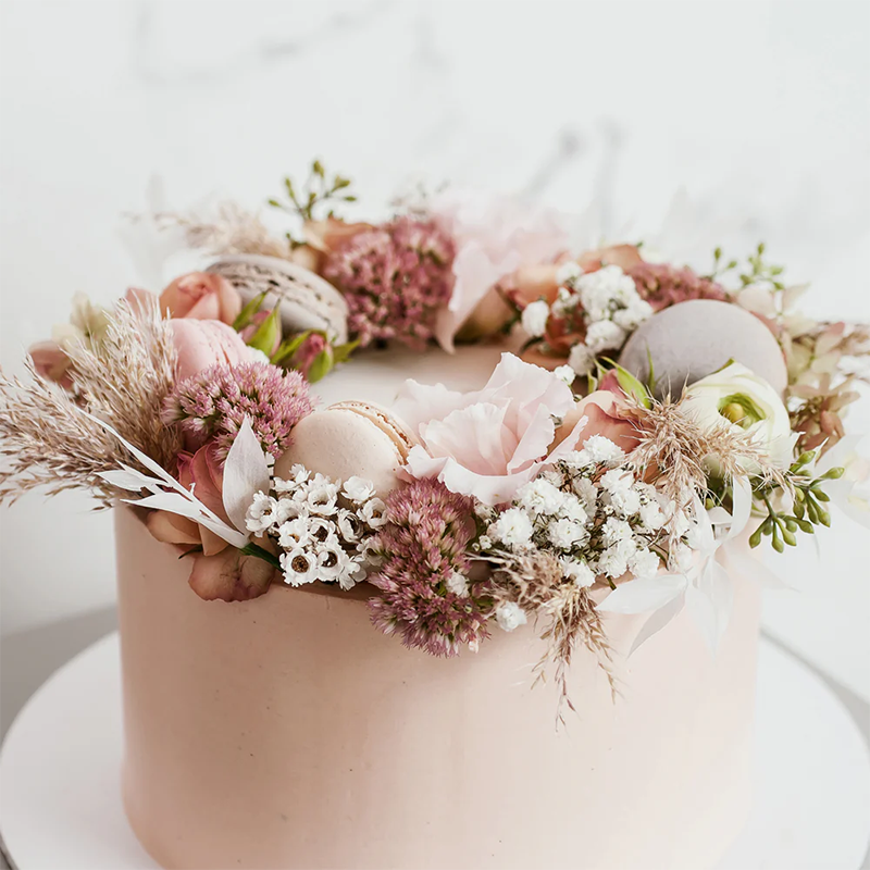 Blueberry Moon Cakes: a photo of a flower-crown wedding cake. www.blueberrymooncakes.co.uk. Bristol, UK